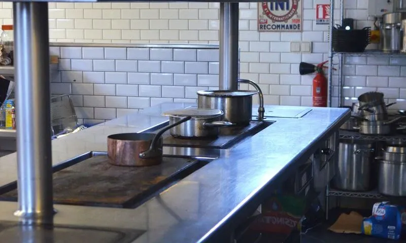 Commercial kitchen in a Sydney restaurant — all kitchen appliances require annual test and tag under AS/NZS 3760 hostile environment rules